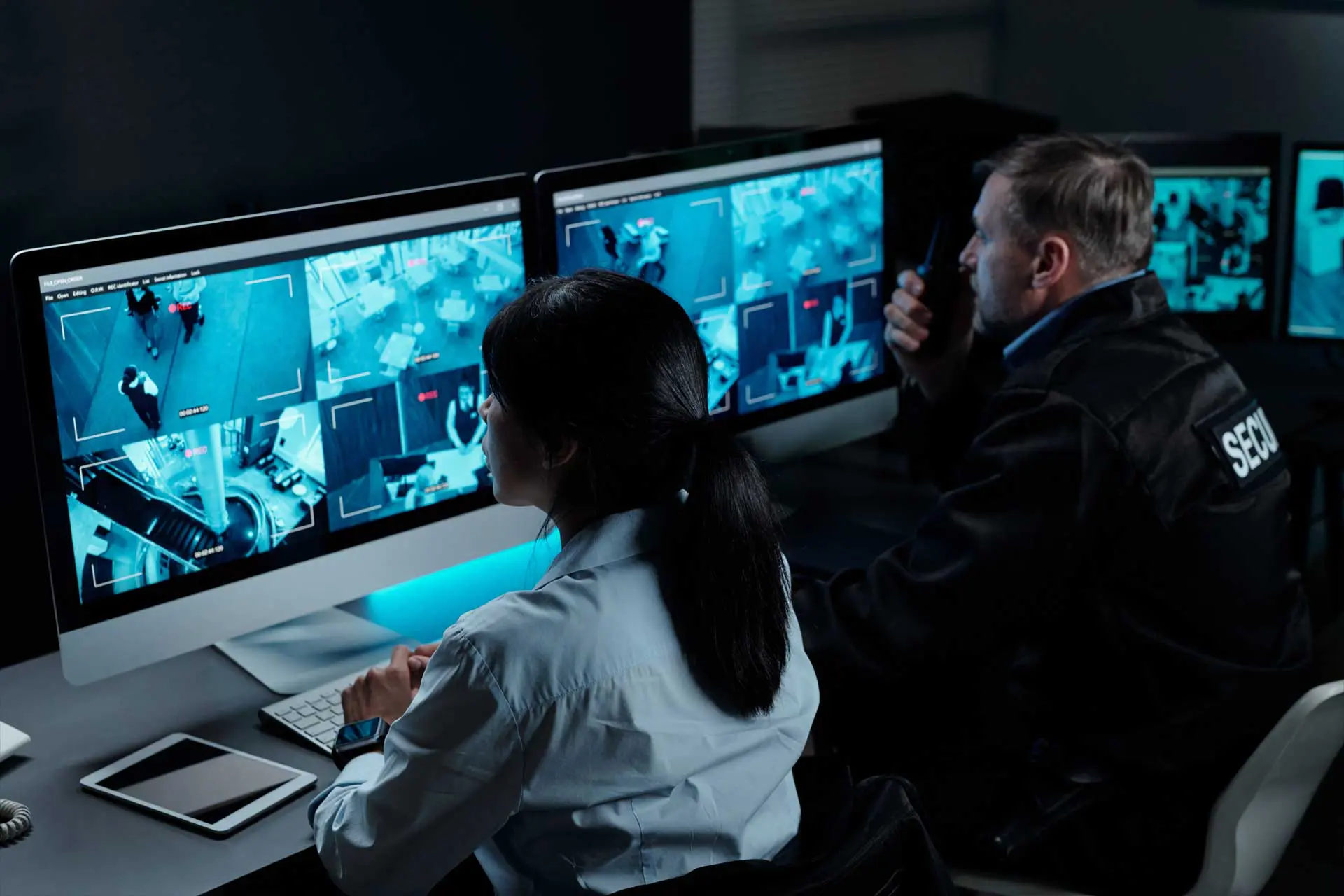 security guards monitoring cctv surveillance screens