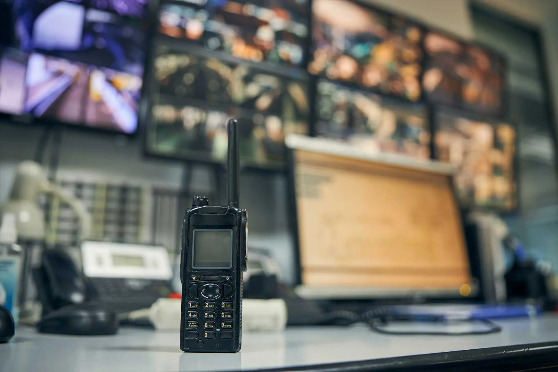 walkie talkie on desk in surveillance room
